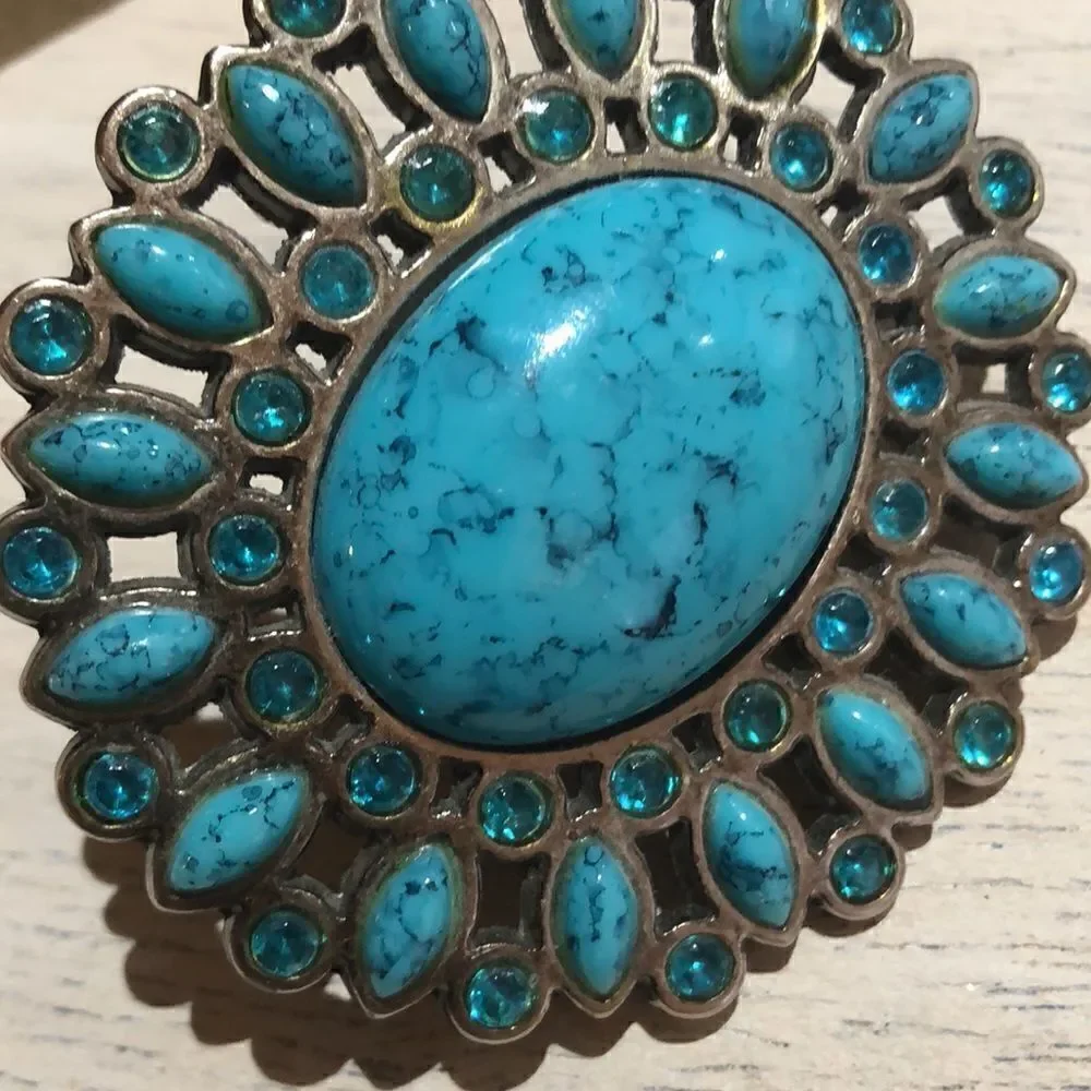 Turquoise faux stone large belt buckle.